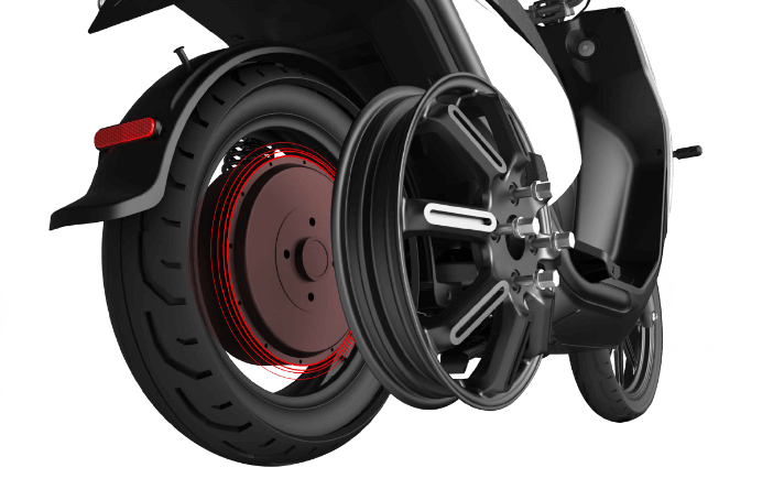 Close-up of a black scooter wheel detached from its tire and frame, showing the rim and tire side by side.