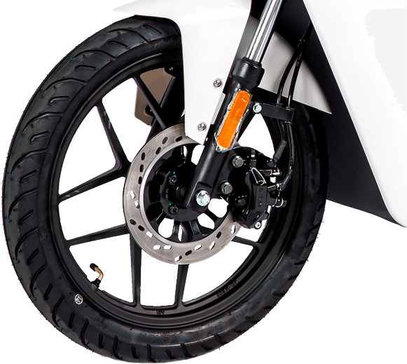 Close-up of a black front motorcycle wheel with tire, disc brake, and white fender.